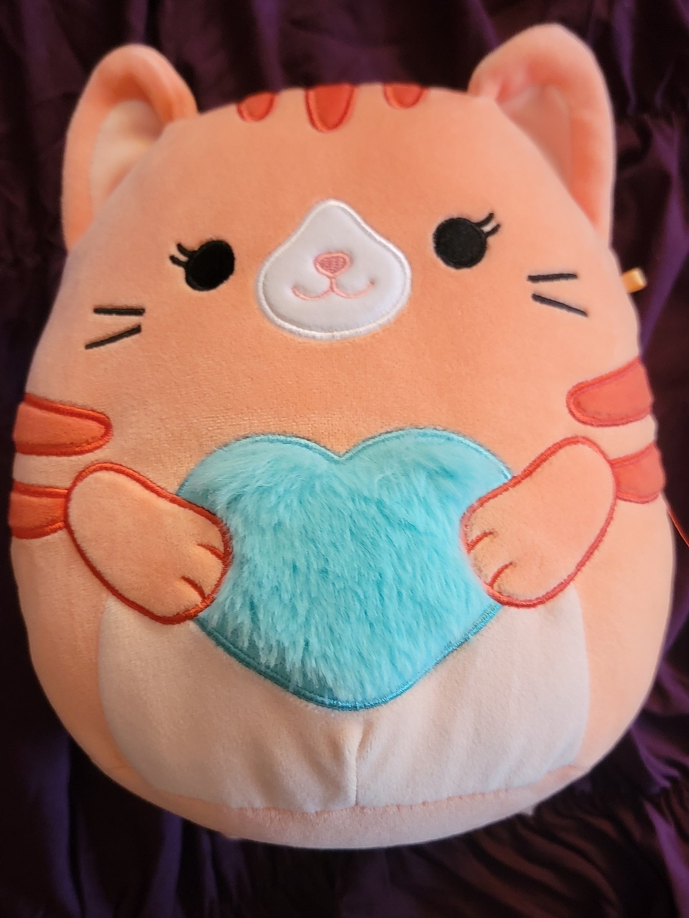 Squishmallows Orange Cat Plush with Blue Heart
